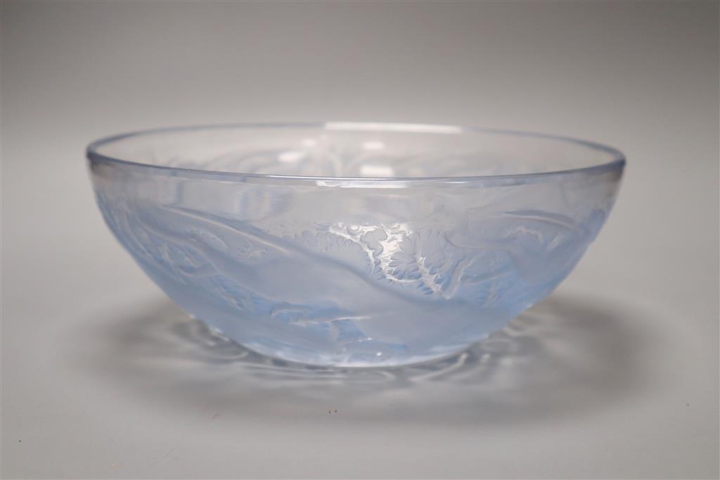 A Lalique Chiens frosted and blue stained glass bowl, moulded mark R Lalique, engraved France no. 3214 to centre, Dia 24cm